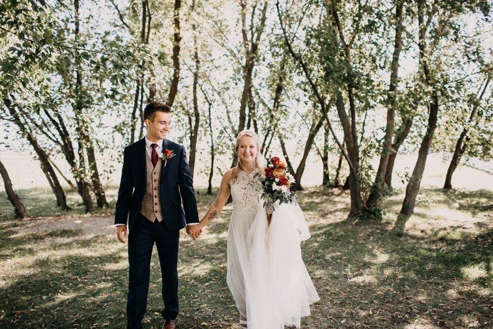 wedding-couple-walking-outside-Eileen-K-Photography